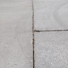 A seam in the asphalt pavement.