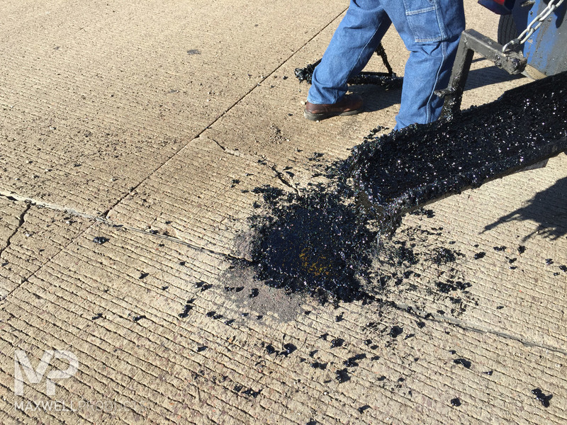 Pothole being repaired by GAP Patch 330.